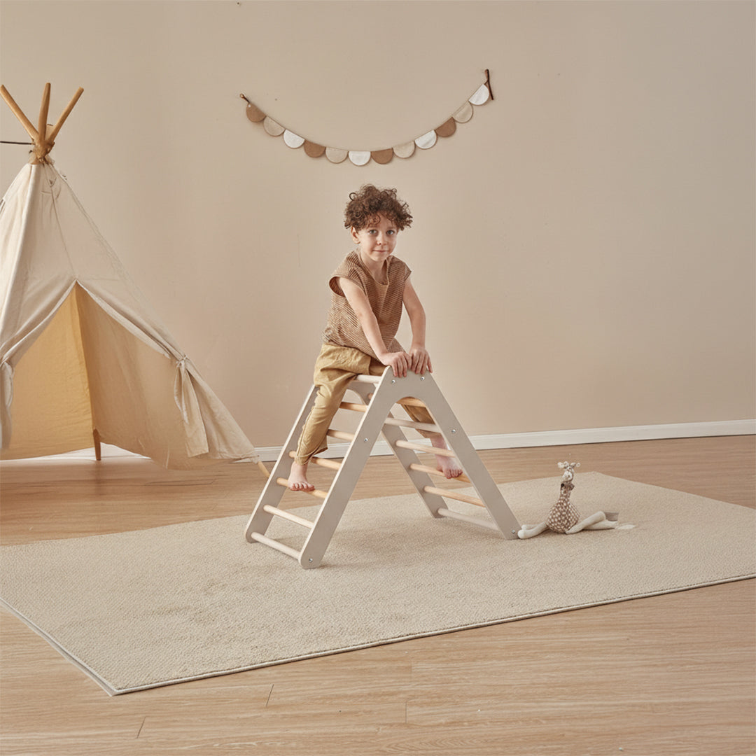 Kids BOORI climbing triangle and board set in natural wood finish, including a triangle, climbing arc, and rectangular board for play.