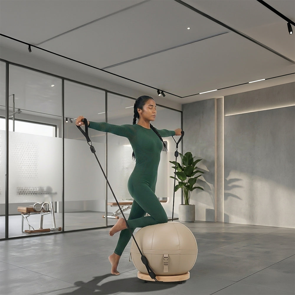 Leather yoga ball with beech wood base by BEACON, designed for gym workouts and stability exercises.