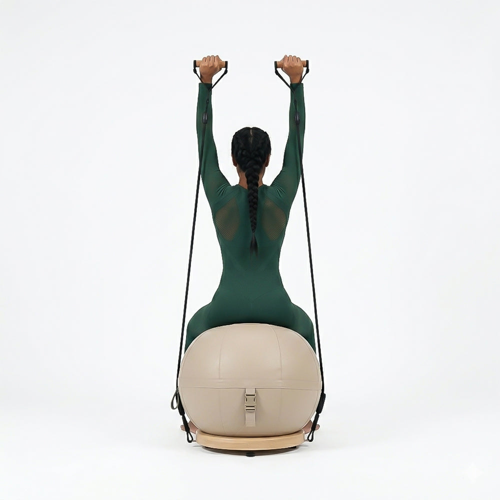 Leather yoga ball with beech wood base from BEACON, featuring a durable leather cover and sturdy wooden support for exercise.