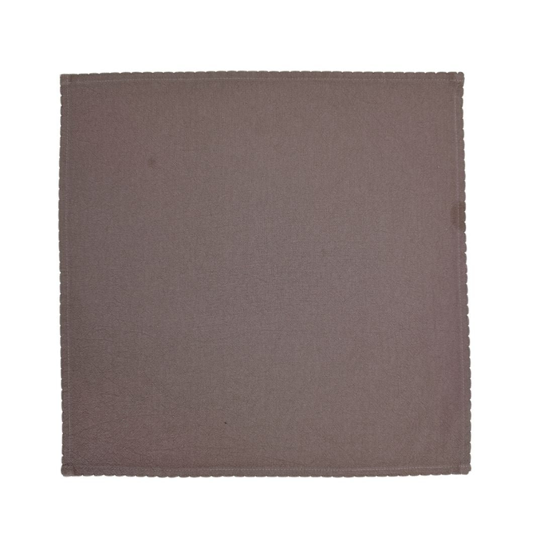 Beige linen and cotton fabric napkin from BEACON, folded with visible texture and stitching for a soft, elegant look.