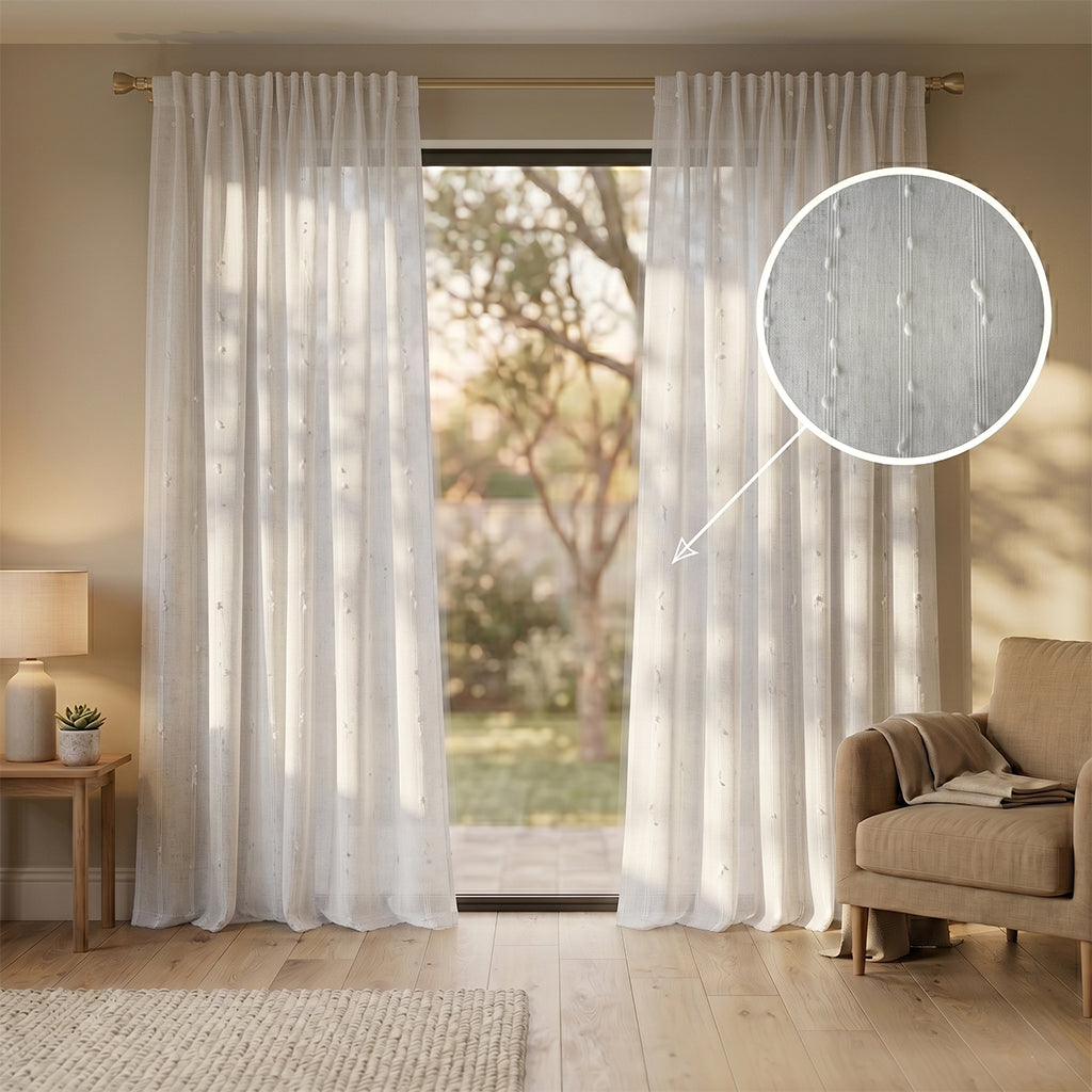 Light gray Mist polyester curtain fabric from BEACON, shown draped with soft texture and subtle sheen.