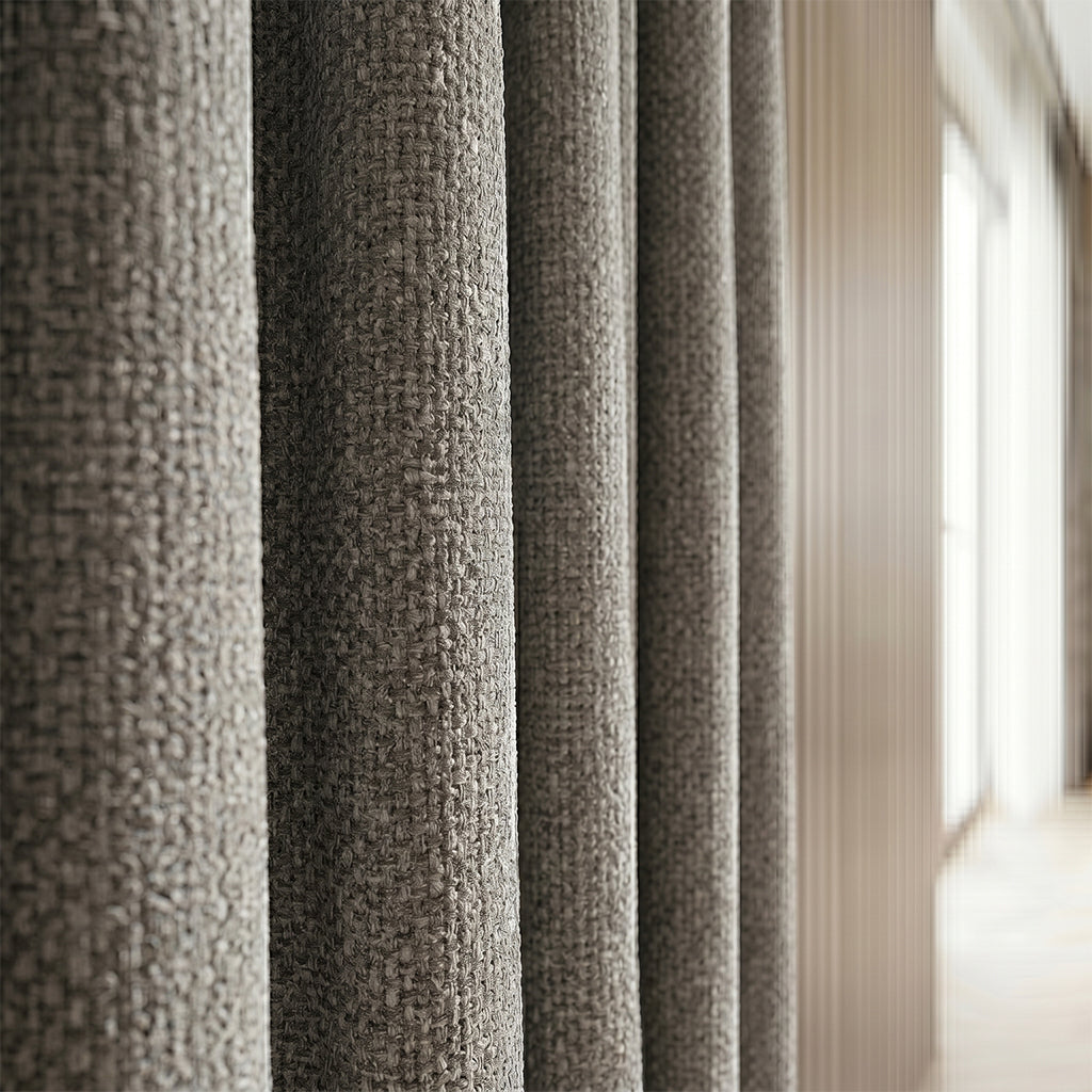Beige mono polyester curtain fabric by BEACON, shown in a close-up of the smooth, durable drapery material.