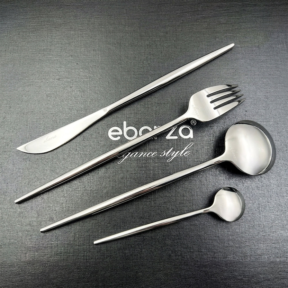 Obsidian 24-piece shiny silver cutlery set by BEACON featuring forks, knives, spoons, and serving utensils on a white background.