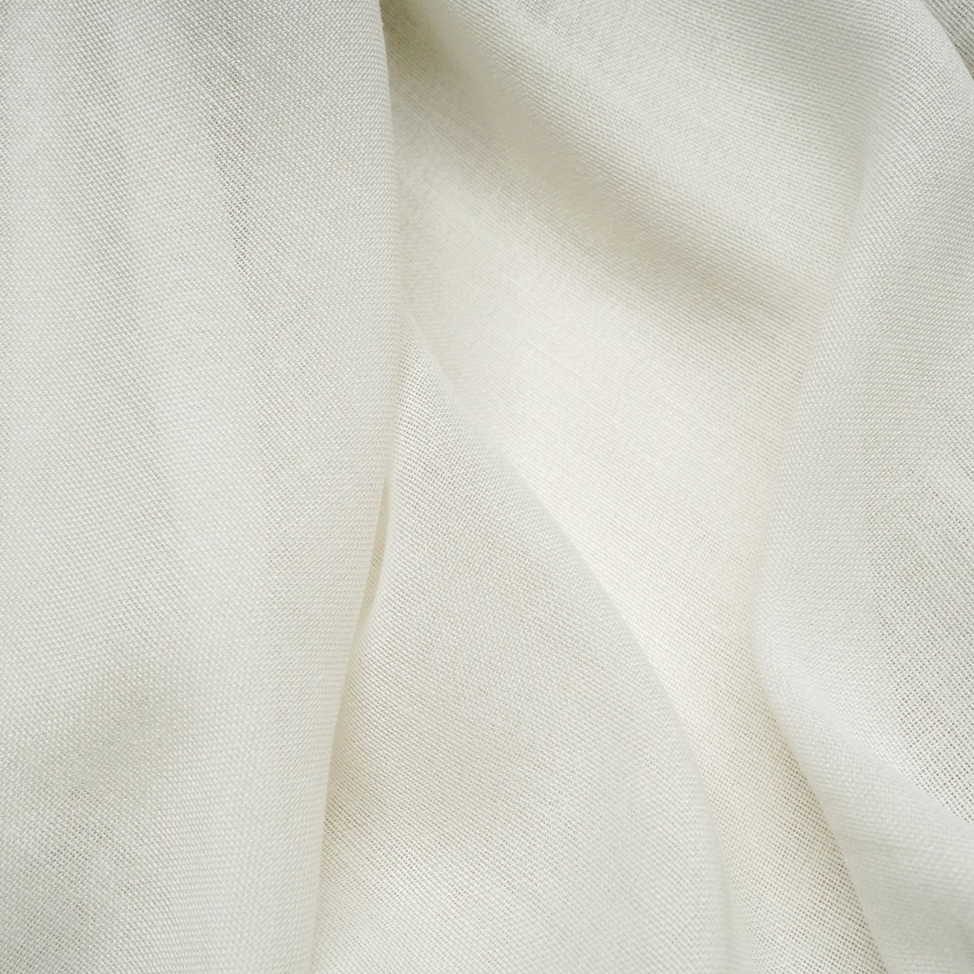 Elegant MARINA window curtain fabric in Crema from QJDG, showcasing smooth drape and luxurious texture.