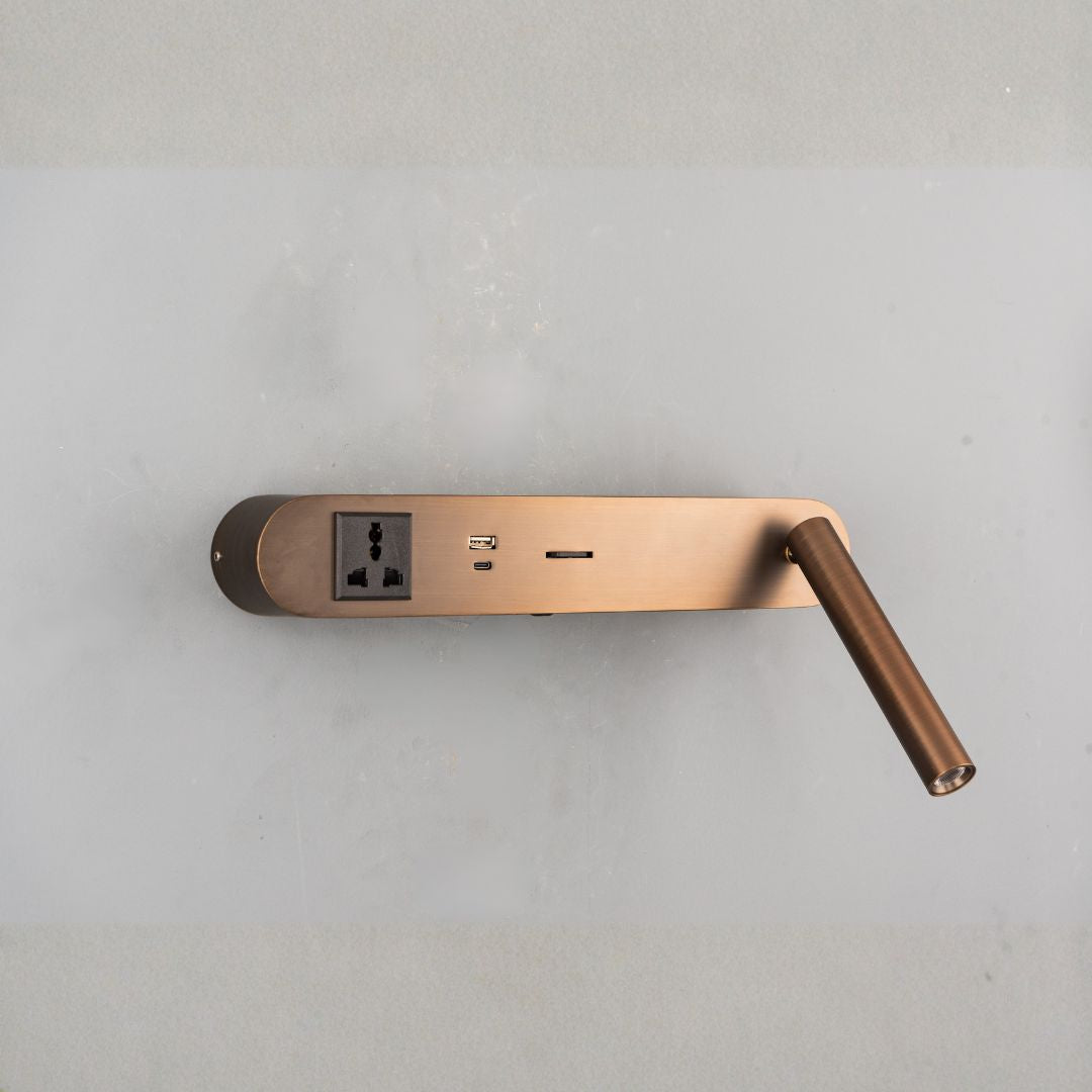 BEACON hotel style wall reading lamp mounted on headboard, featuring a sleek design and adjustable arm for bedside reading.