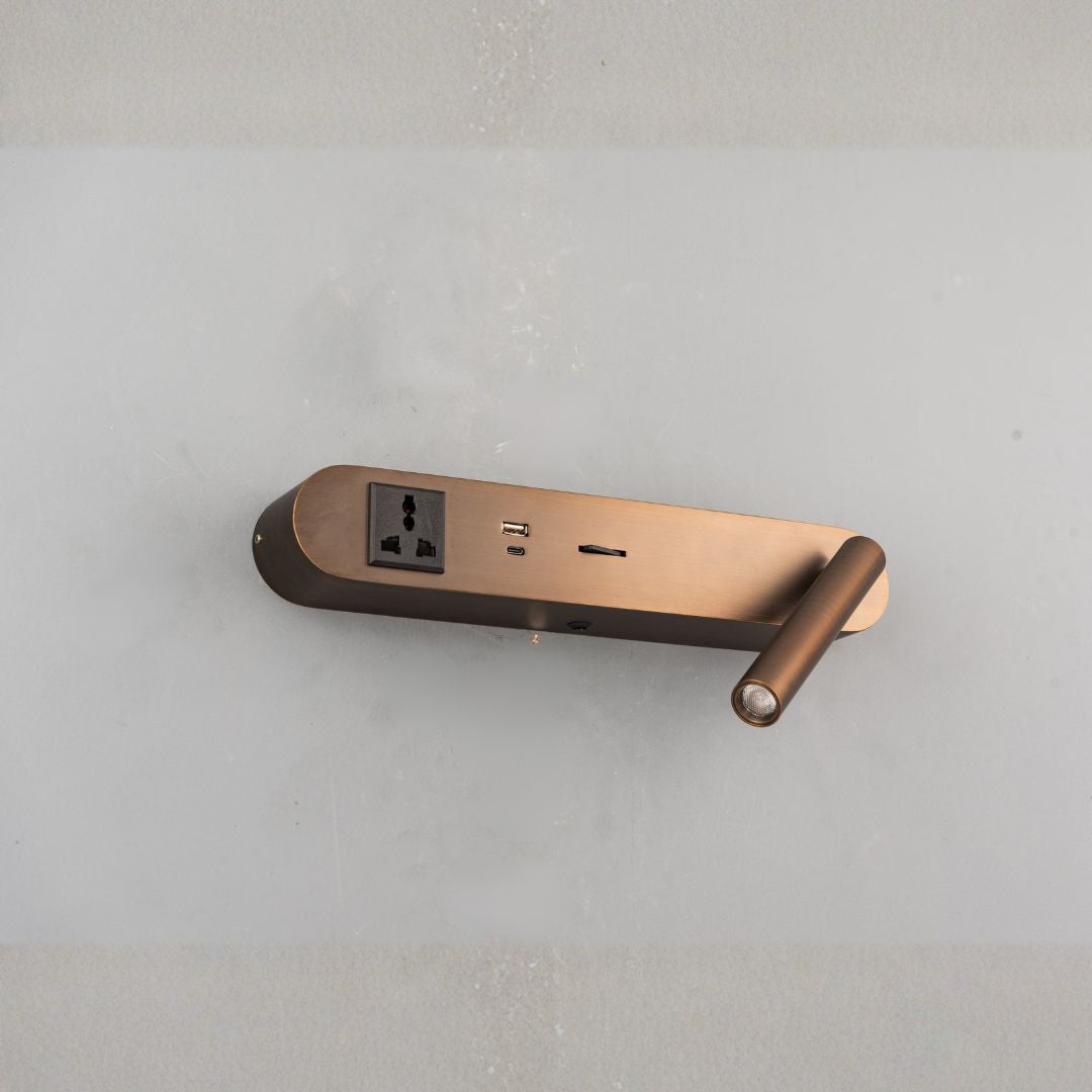 BEACON hotel-style wall reading lamp mounted on a headboard, featuring a sleek design and adjustable arm for bedside illumination.