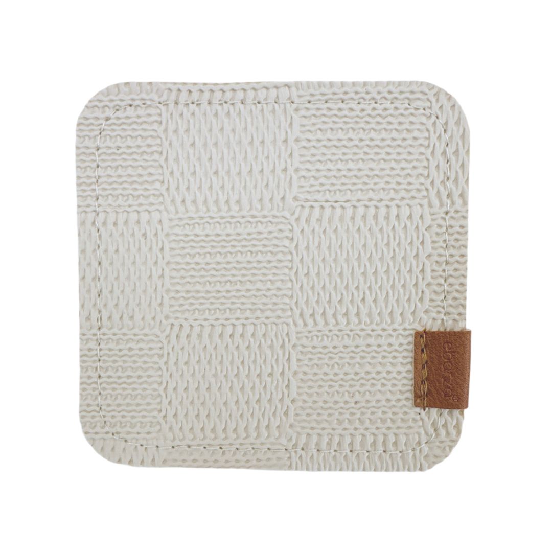 Set of four beige BEACON coasters with a smooth finish, designed to protect surfaces from drink spills.