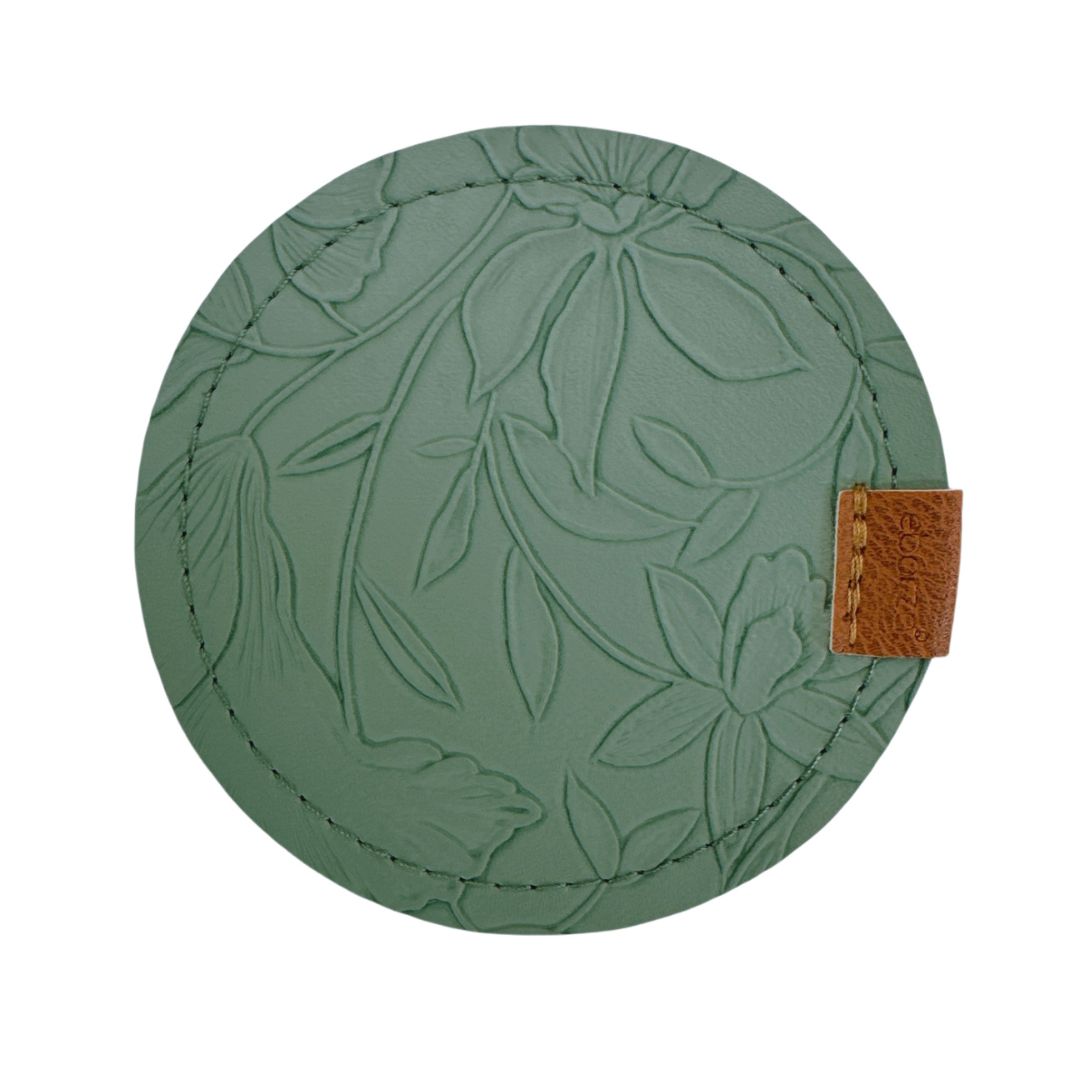 Set of four green coasters with a sleek design from BEACON, perfect for protecting surfaces in stylish home decor.