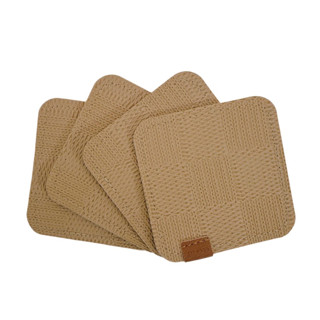 Set of four taupe and grey BEACON coasters, round with a smooth matte finish, designed to protect surfaces from drinks.