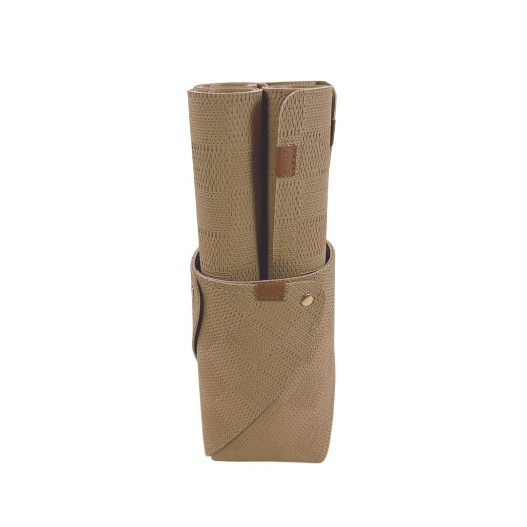 Set of four taupe placemats from BEACON with basket packaging, featuring a stylish and practical table setting accessory.