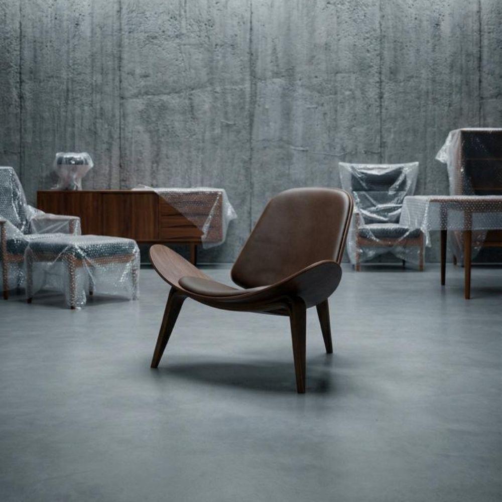 Brown leather and wood lounge chair from BEACON, featuring a modern design with a comfortable, stylish appearance.