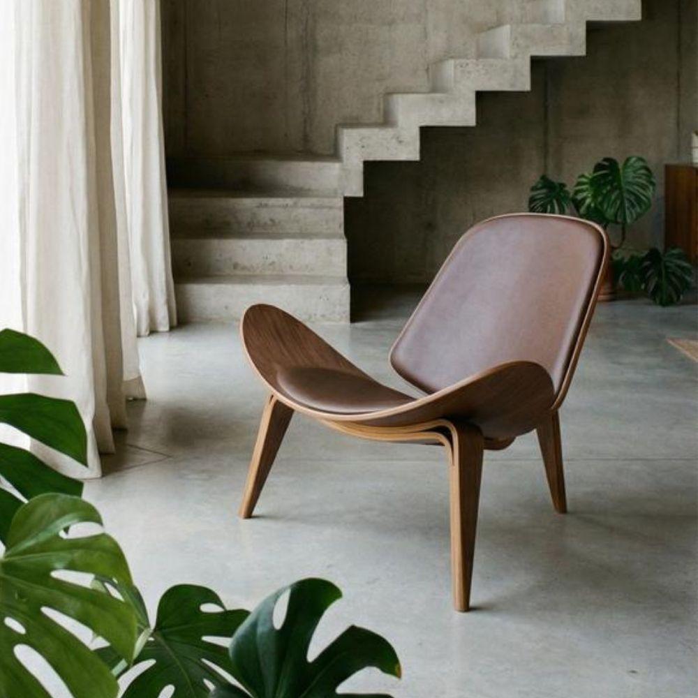 Brown leather and wood lounge chair from the Smile collection by Beacon, featuring a sleek, modern design and comfortable seating.