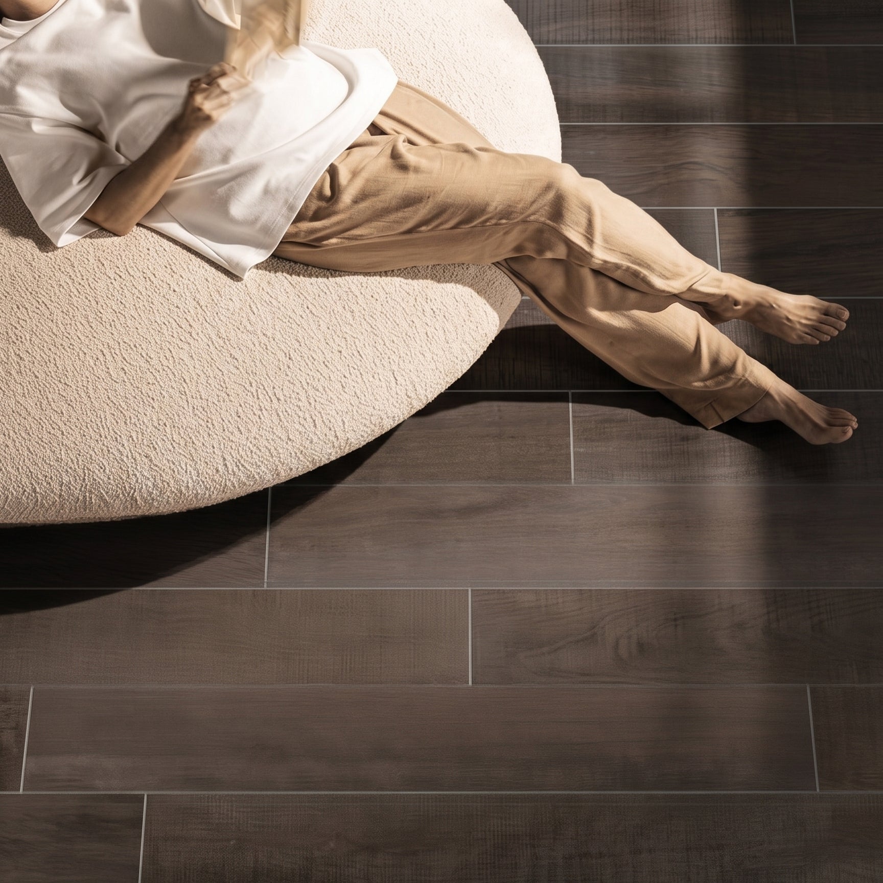 Stone Plastic Composite SPC parquet set in walnut finish, featuring 76.2cm by 12.7cm planks with a 0.6cm thickness.