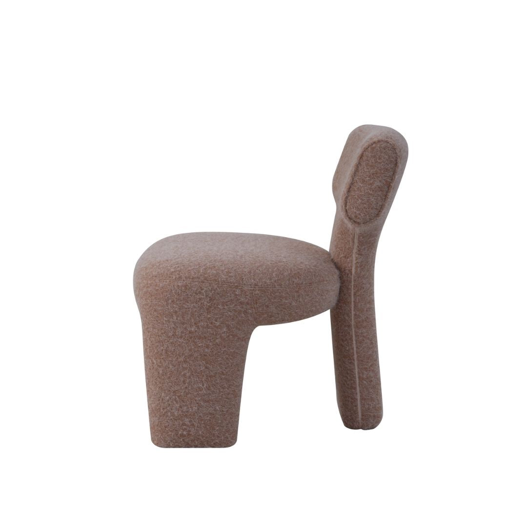 BEACON Torus Lounge Chair AMF-DY562 armchair with curved modern design, upholstered in textured fabric, placed in a stylish living room setting.