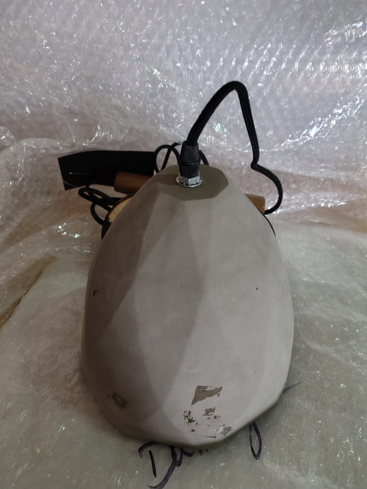 Large convex concrete and wood lamp display item by Beacon JXYDG with a modern, sculptural design and mixed material finish.