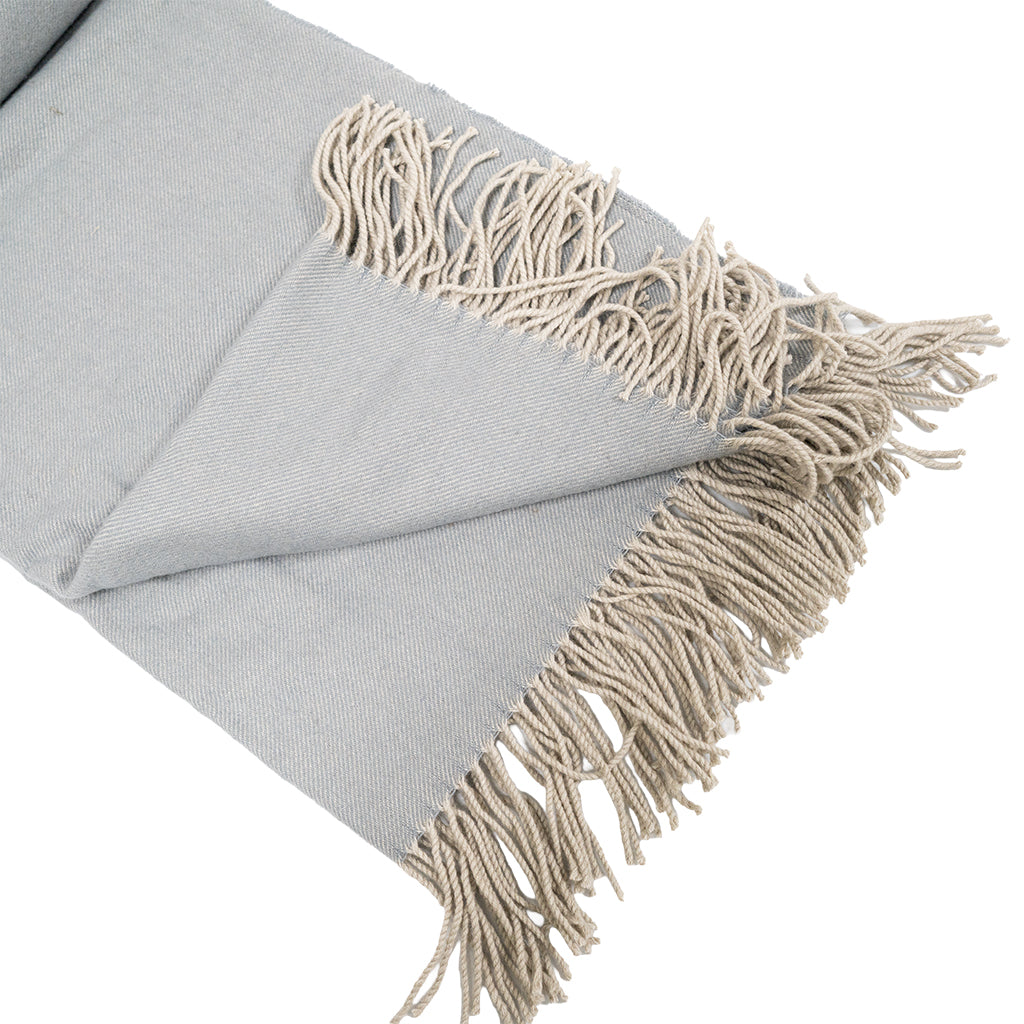 BEACON wool throw blanket in natural hues with a soft, cozy texture, perfect for added warmth and comfort.