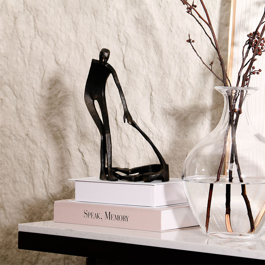 Abstract metal sculpture by BEACON, modern home decor figurine with sleek, artistic design in a contemporary style.