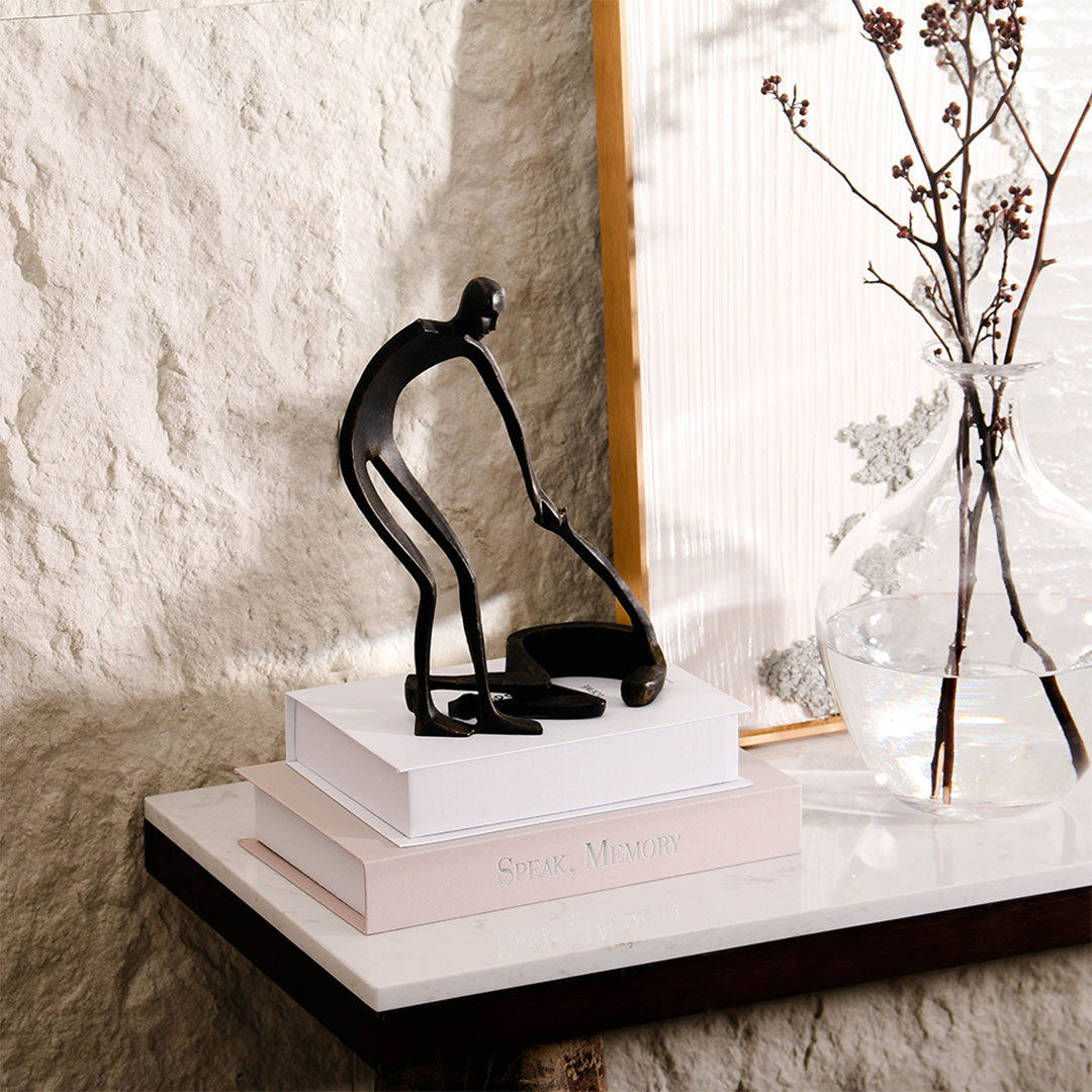 Abstract metal sculpture for home decor by BEACON, sleek modern figurine with artistic design in silver finish.