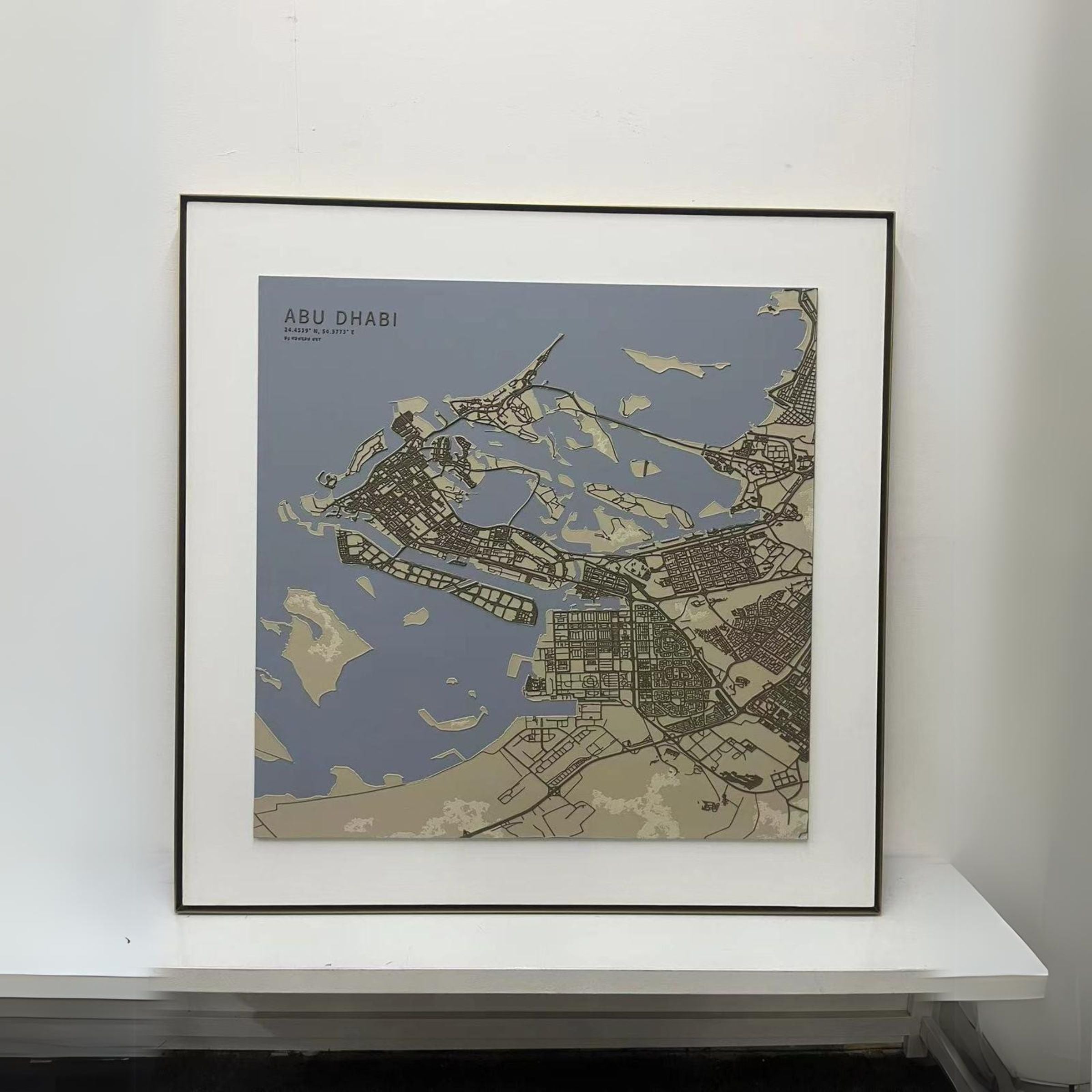 Handmade Abu Dhabi map painting, 140x140 cm, by BEACON, featuring detailed city illustration on canvas.