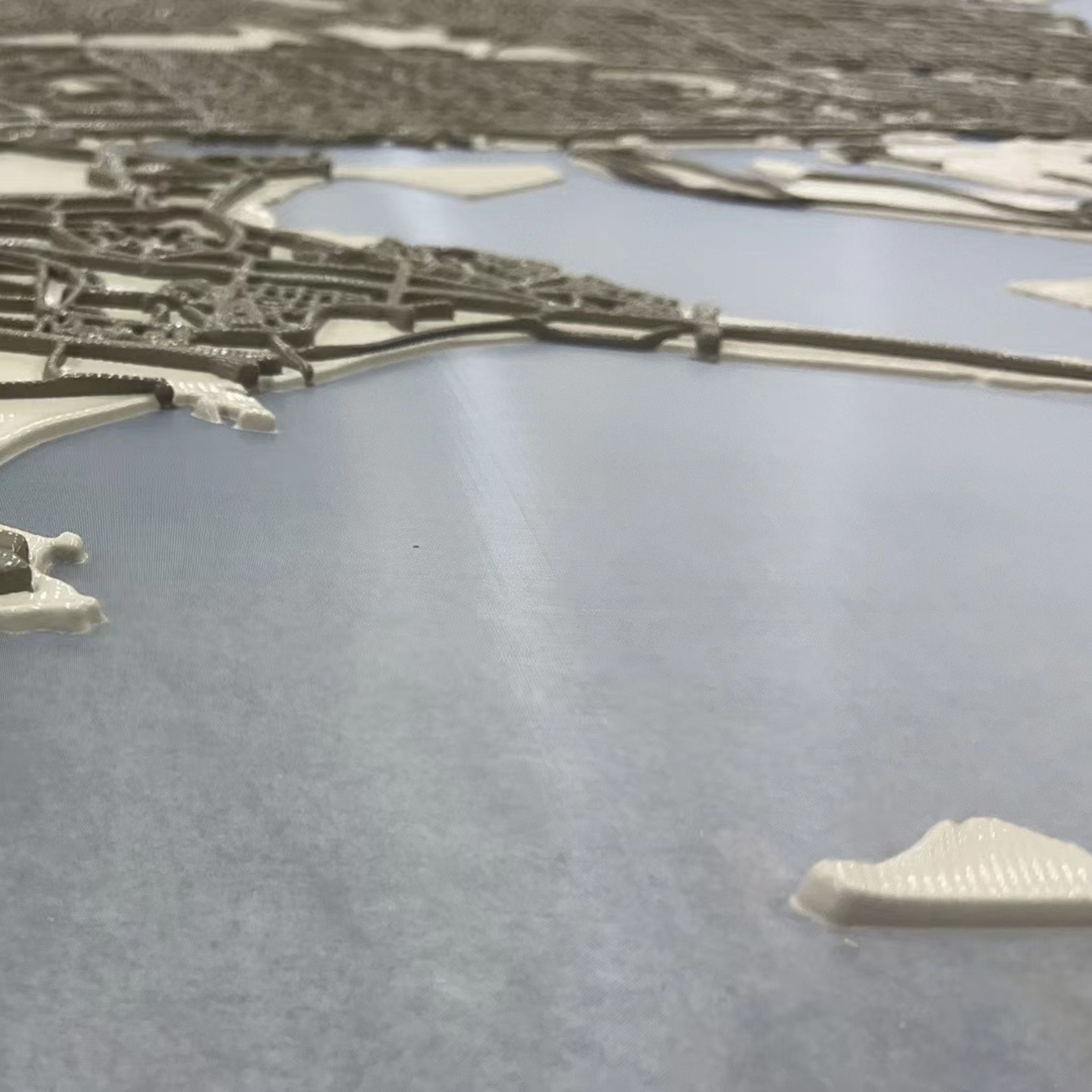 Handmade Abu Dhabi map painting by BEACON, 140x140 cm, detailed artwork on canvas showing city layout and landmarks.