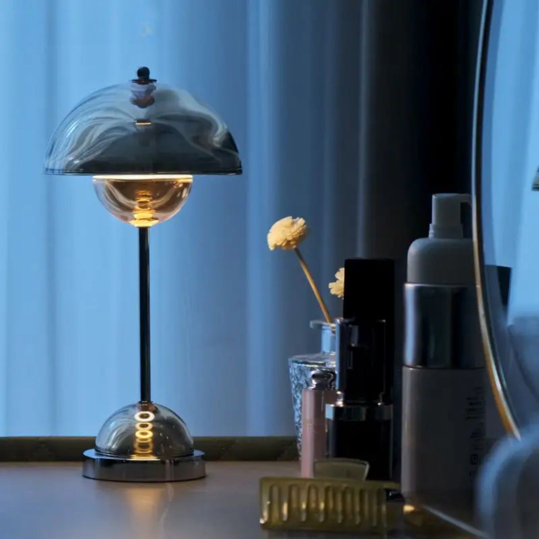 Amber rechargeable LED table lamp by Beacon, featuring a sleek design, ideal for desk or table lighting.