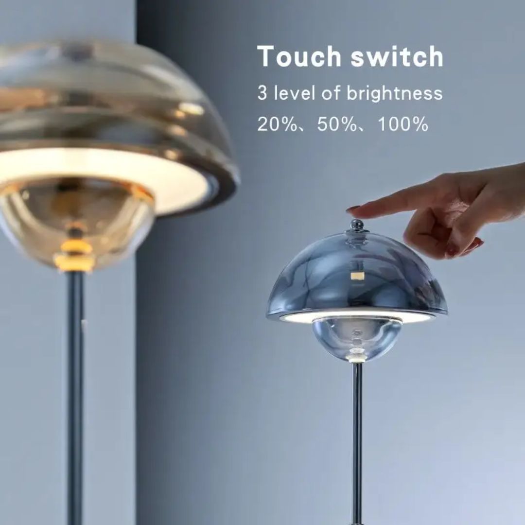 Amber rechargeable LED table lamp from Beacon, designed for desks and tables, with a sleek, modern appearance and adjustable lighting.