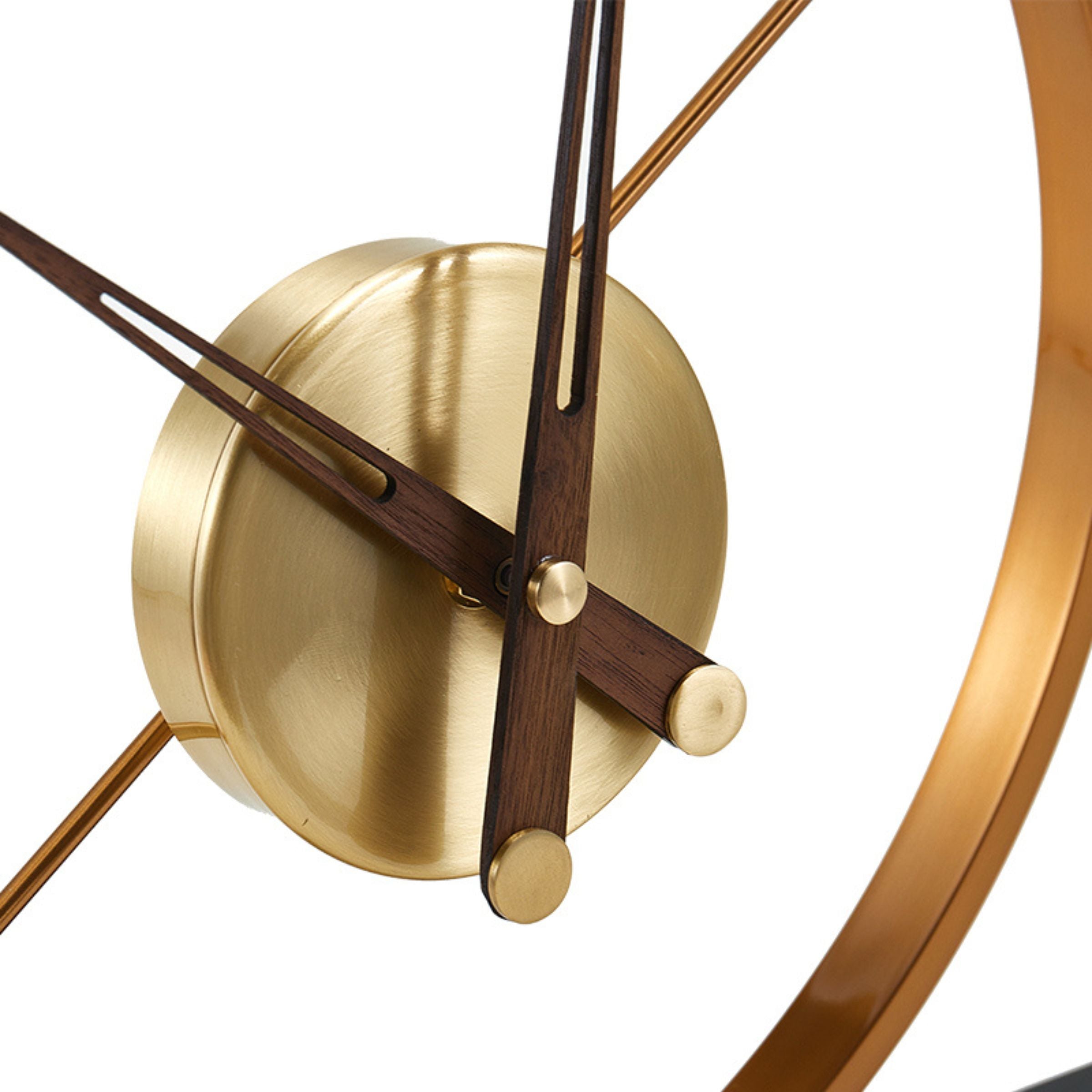 Antique brass iron and marble tabletop clock by Beacon, vintage style with intricate design, and polished finish.