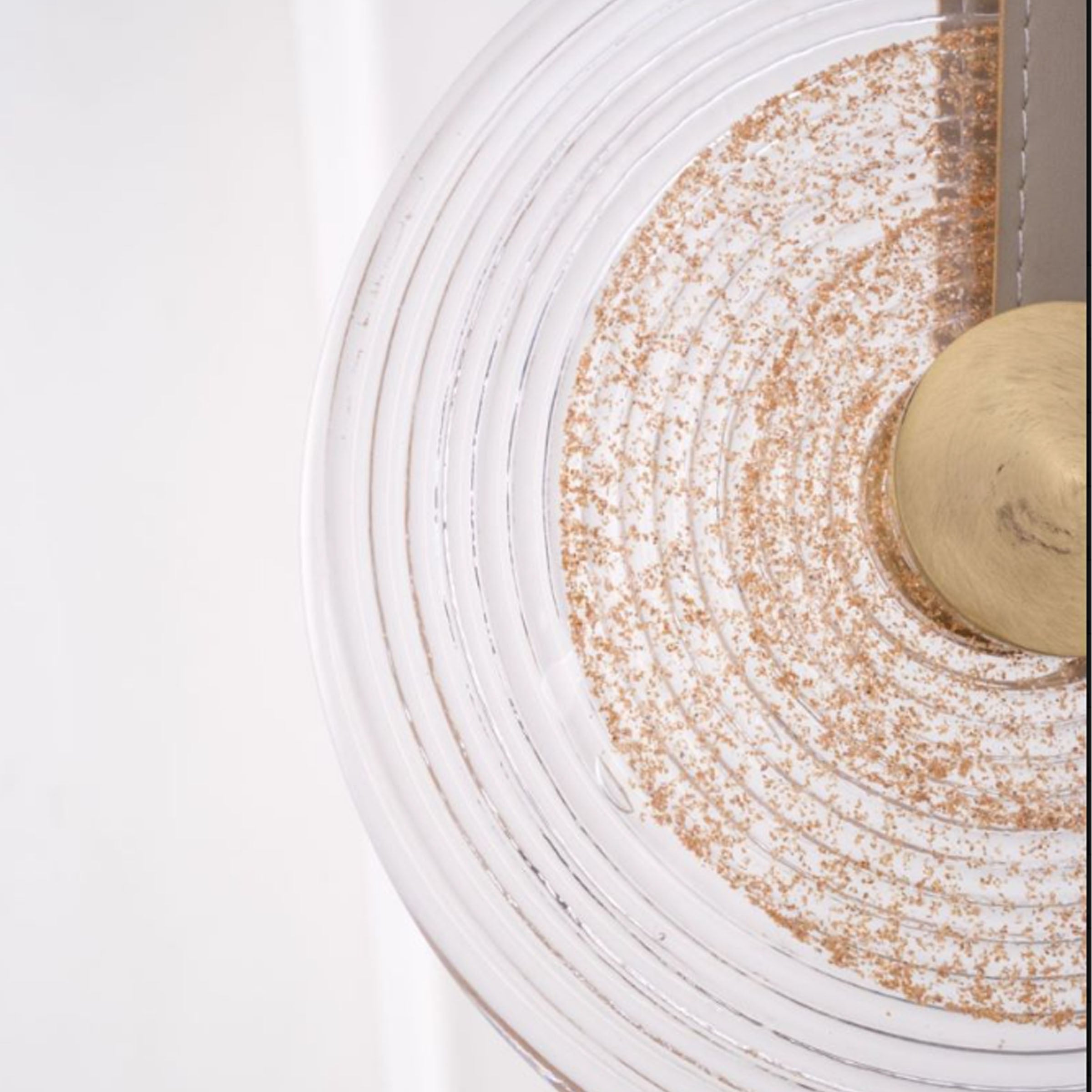 A beige leather Aqua Gem pendant lamp with a 20cm diameter, modern design, hanging from a ceiling fixture.