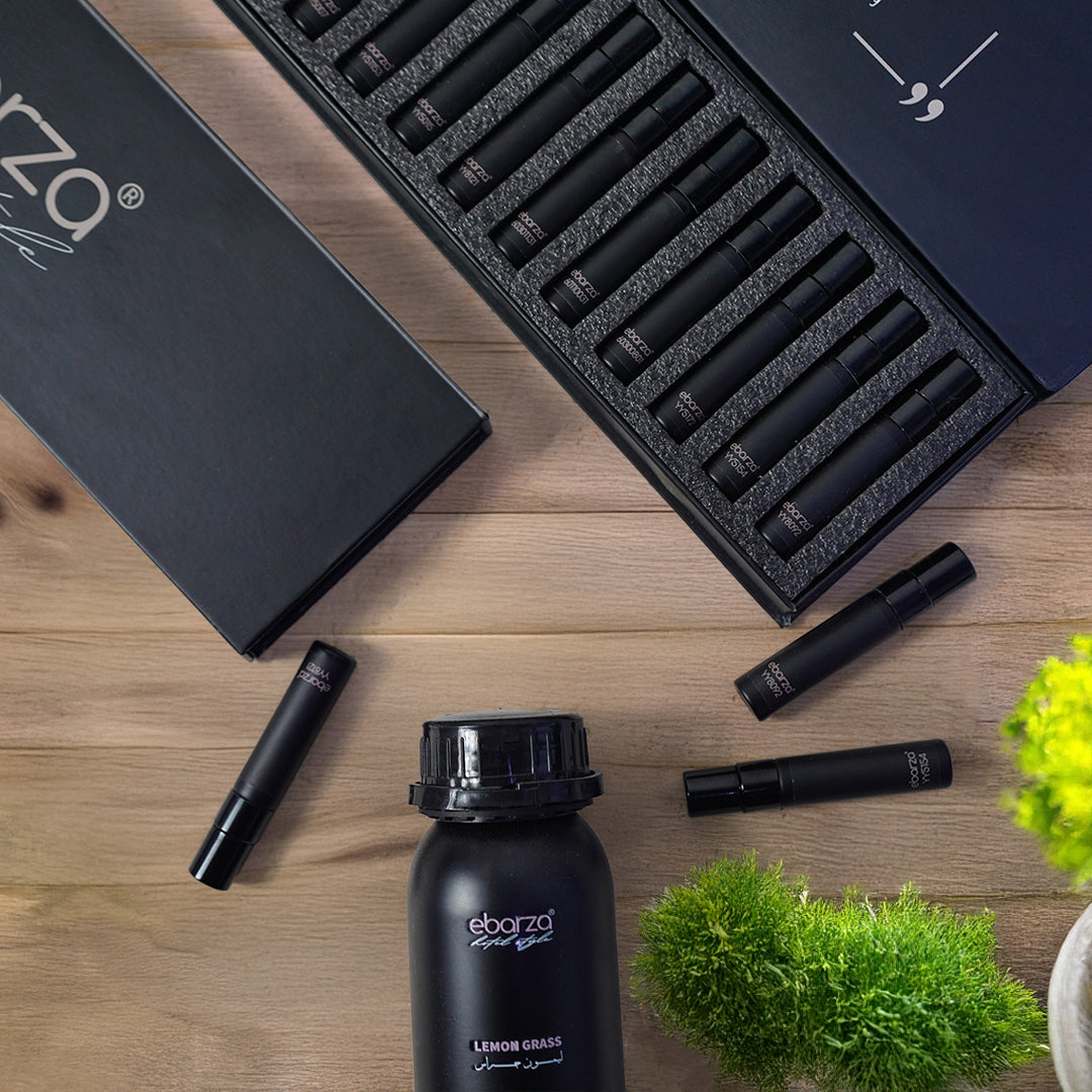 A selection of essential aroma oils in a sample box for ebarza Smart Scent Diffusers by BEACON, displayed in small bottles.