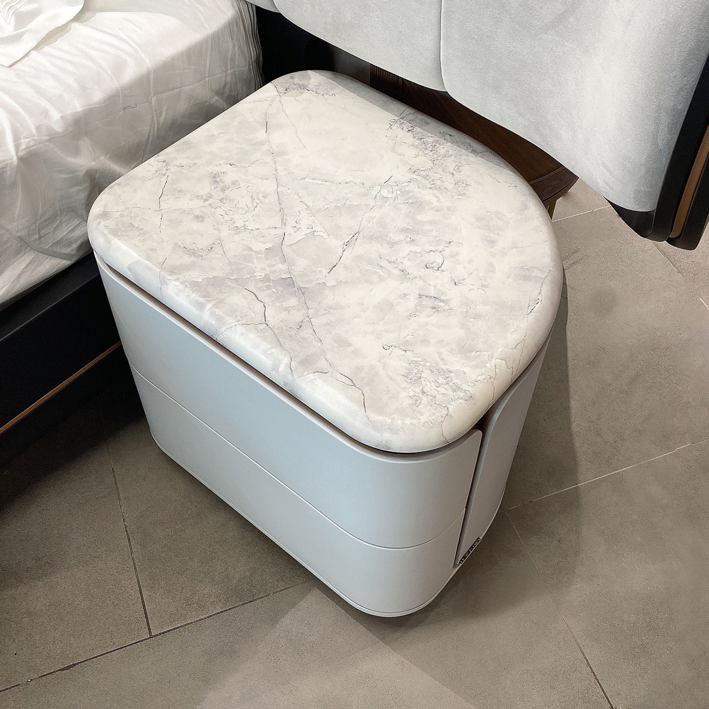 Two tulip-style bedside tables in a display setting, featuring a modern design from LODA Furniture.