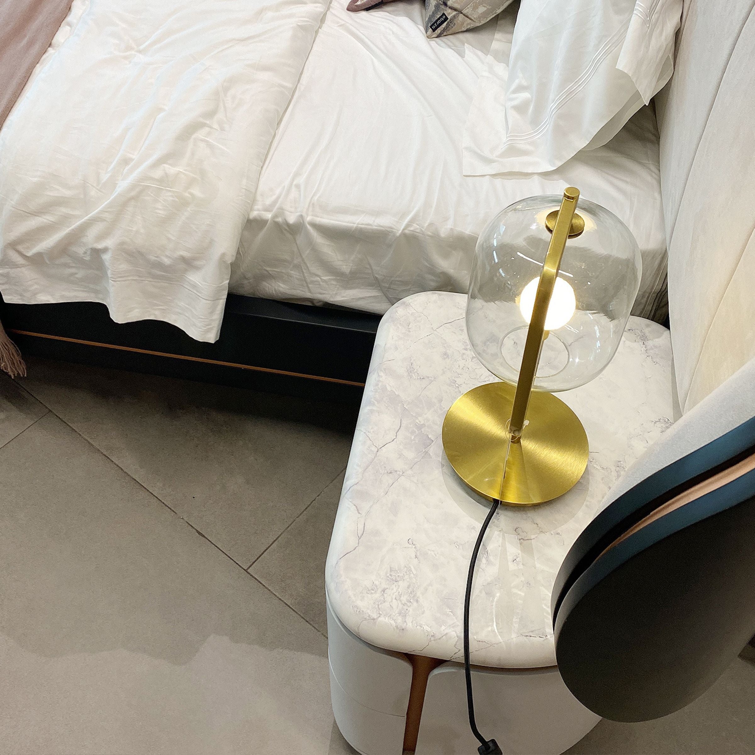 Two LODA Furniture Tulip Bedside Tables in display condition, showcasing their unique tulip shape and modern design.