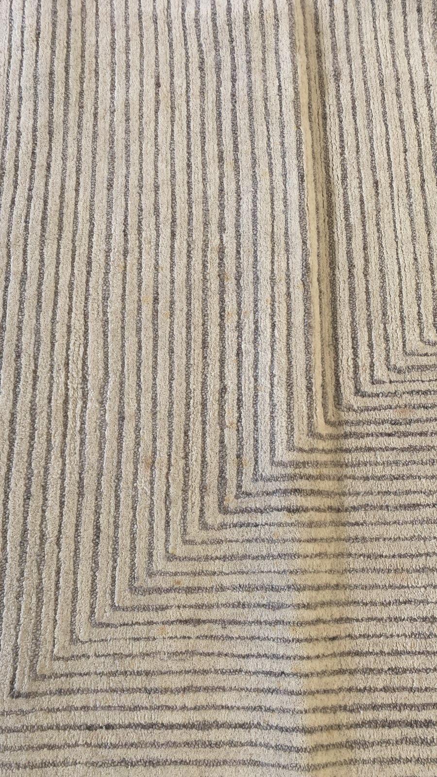 Handmade 300x200 cm rug display item by Javi, showing intricate patterns and textured surface in neutral tones.