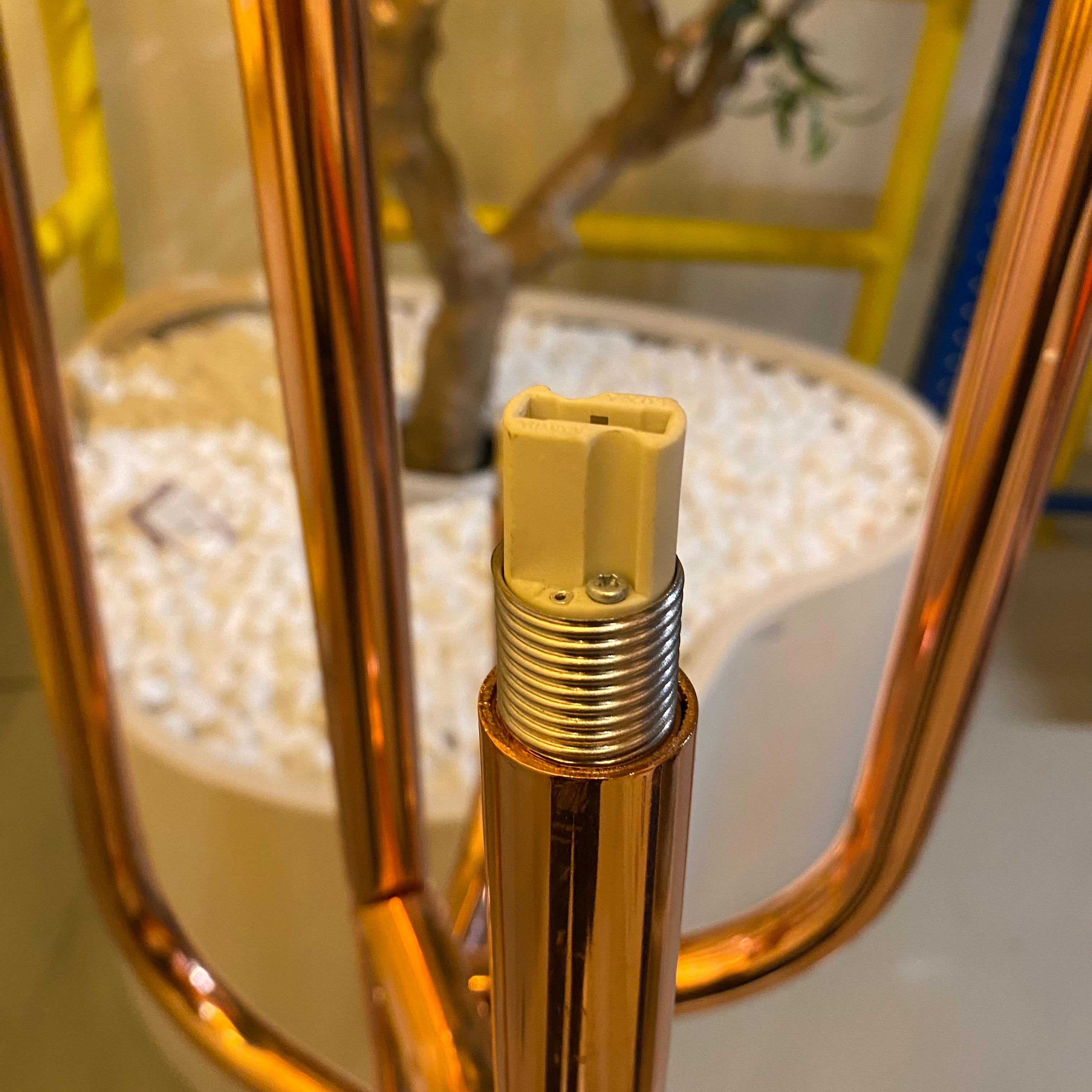 As-is Beacon candlestick floor lamp with a vintage design, featuring a tall metal stand and a decorative bulb socket.