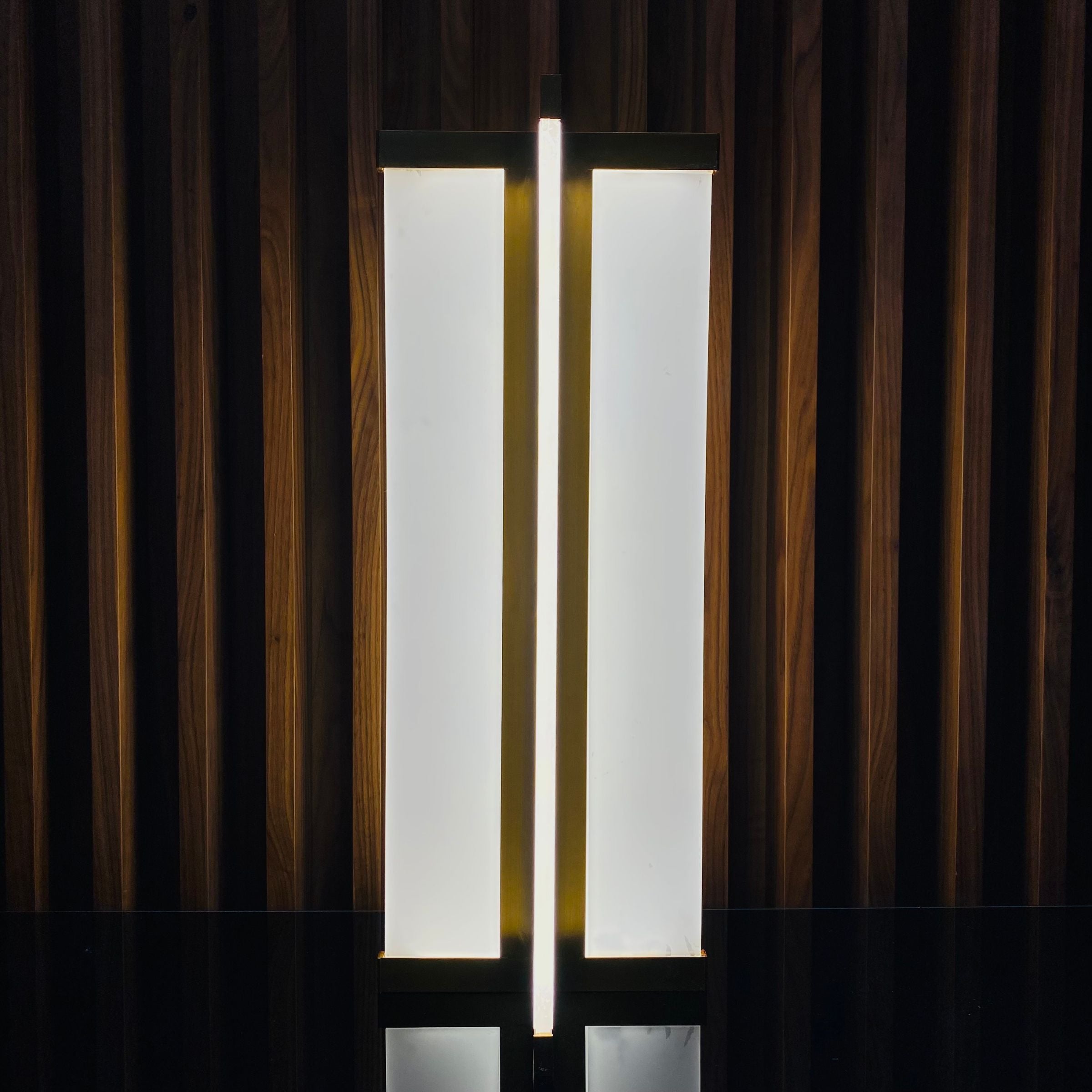Golden BEACON table lamp display item with a sleek design, featuring a golden finish and modern shape.