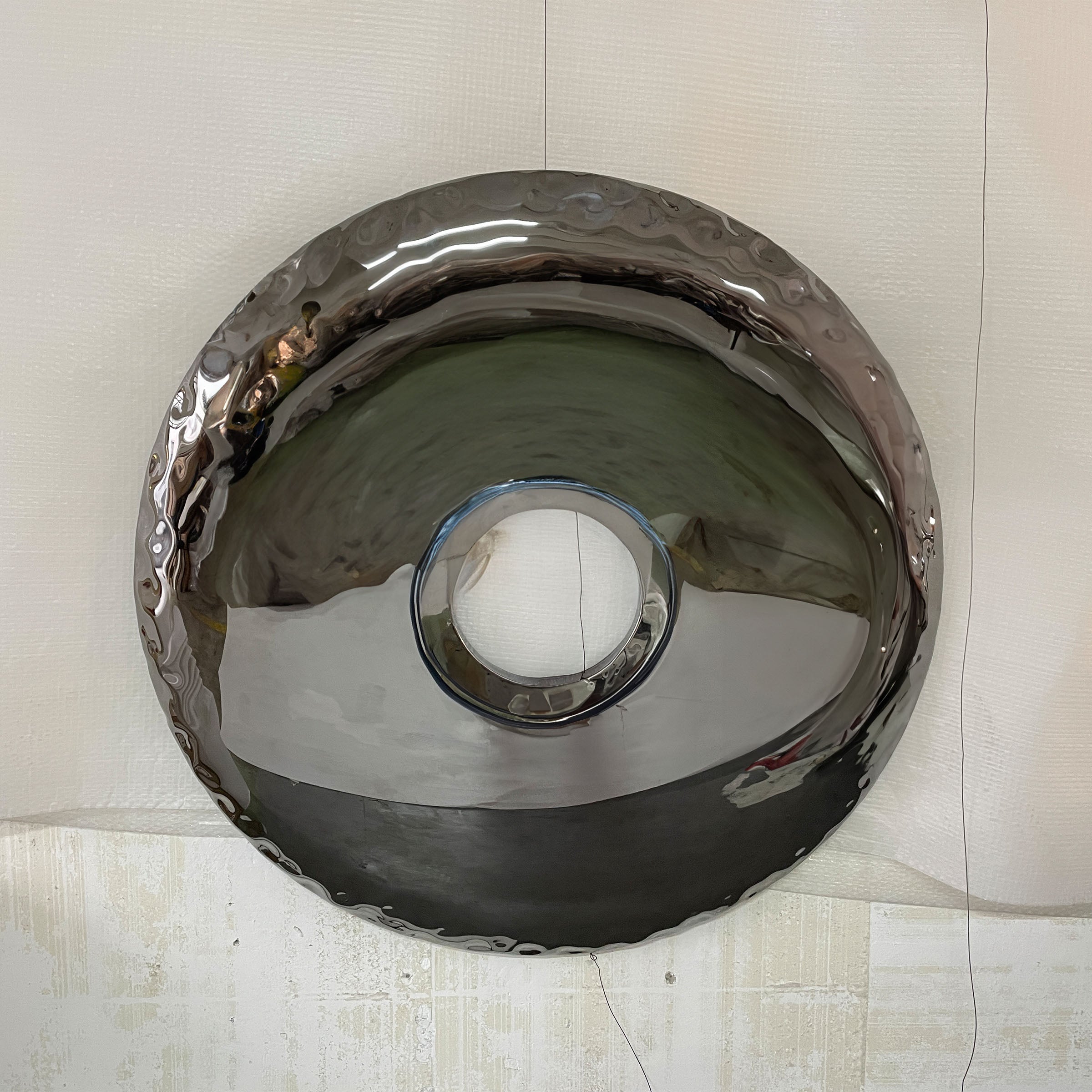 Handcrafted stainless steel artwork with specular color finish by BEACON, showcasing modern abstract design.