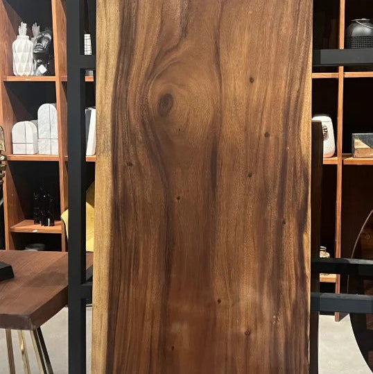 Live edge dining table by SANCREA with natural wood finish, showcasing the rustic, handcrafted design and smooth surface.