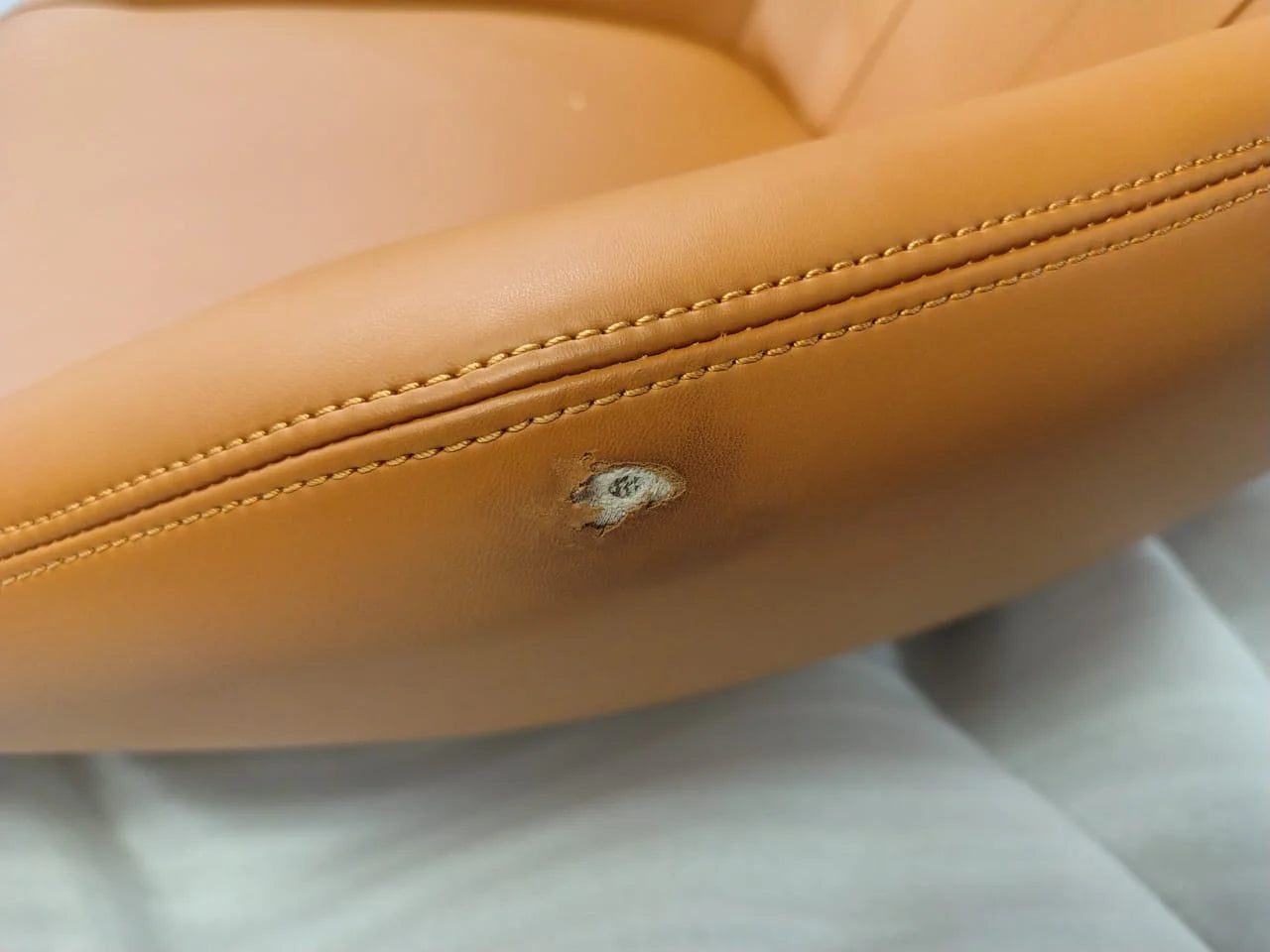 As-is Relax Lounge Chair LC035-BR by Beacon, display item showing beige cushioned lounge chair with wooden legs and modern design.