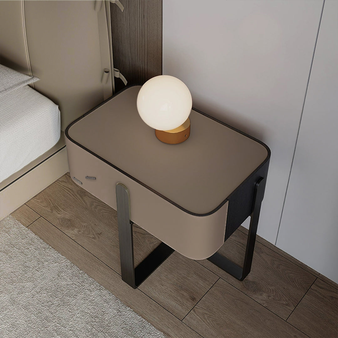 Saddle leather bedside table by BEACON with a sleek design, featuring a smooth leather surface and modern bedside storage.