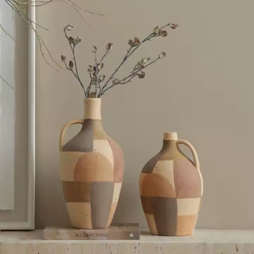 Assorted color hand-painted ceramic vase by BEACON, showcasing vibrant, artistic floral designs on a smooth ceramic surface.