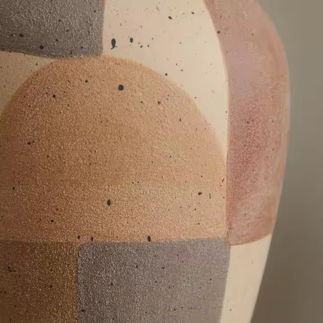 Assorted color hand-painted ceramic vase by BEACON, featuring vibrant, artistic designs for decorative home display.