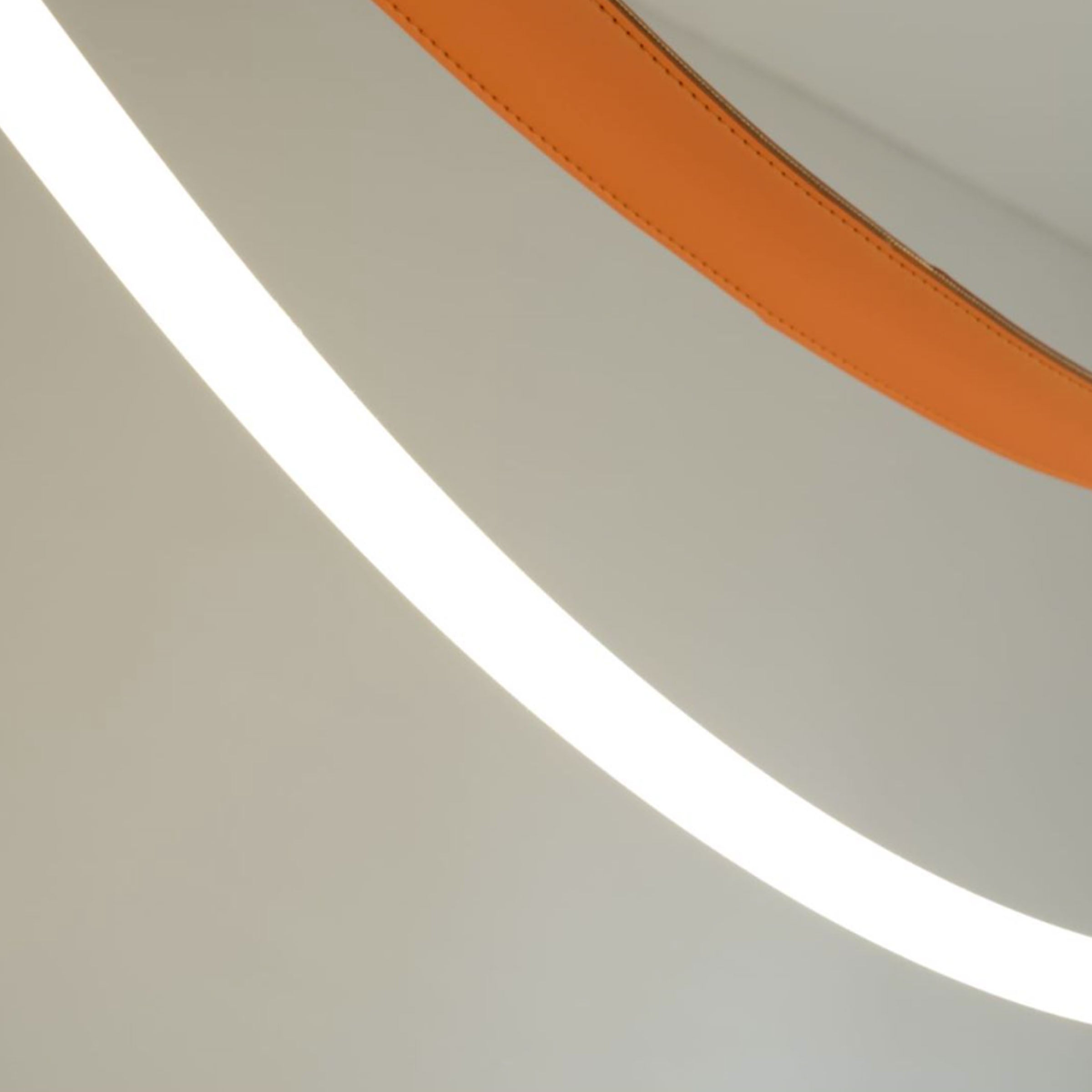 Aurora Borealis orange leather and golden pendant lamp by BEACON, 4-meter length, modern lighting fixture with vibrant design.