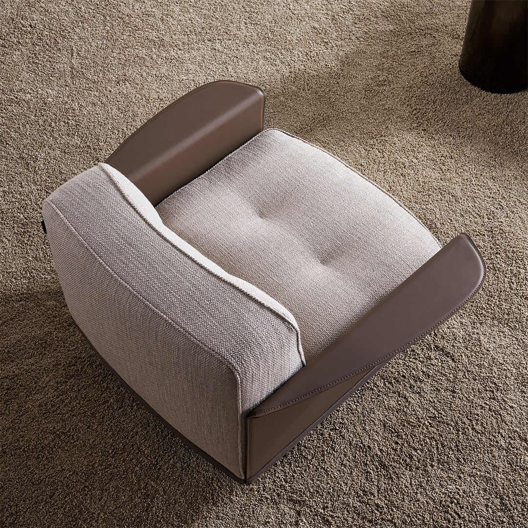 A beige BEACON Avenor armchair with wooden legs and plush fabric upholstery, stylish and comfortable seating for living room.