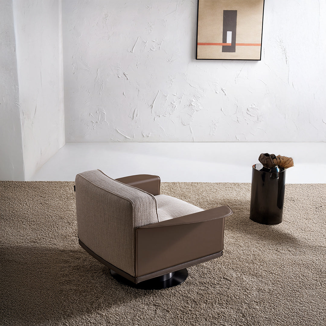 A beige BEACON Avenor armchair with plush fabric upholstery and a modern design, shown from a side angle.