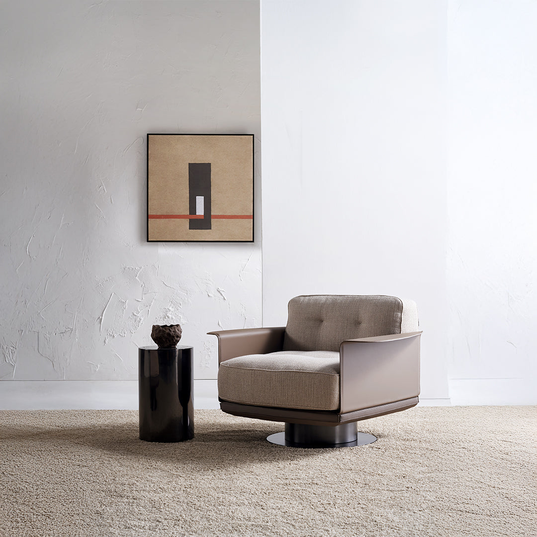 A beige BEACON Avenor armchair with plush fabric, modern design, and wooden legs, positioned in a contemporary living room setting.