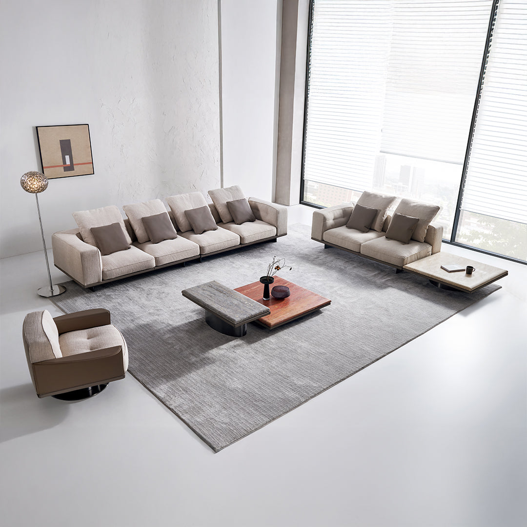 A beige BEACON Avenor armchair with plush fabric and modern design, featuring a comfortable cushioned seat and backrest.