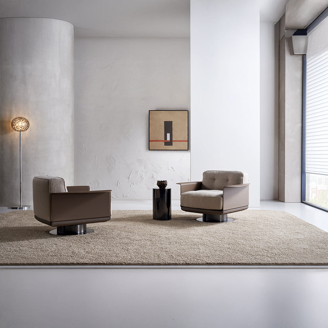 A beige BEACON Avenor armchair with plush cushioning and wooden legs, showcasing its stylish and comfortable design.