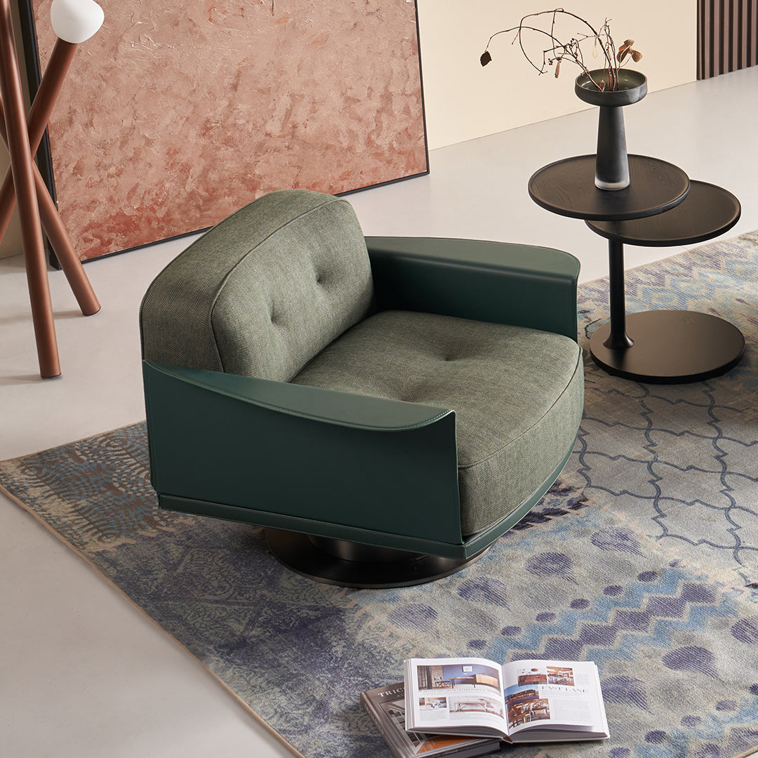 Green Avenor armchair by BEACON, featuring plush upholstery and a modern design, perfect for living room or lounge areas.
