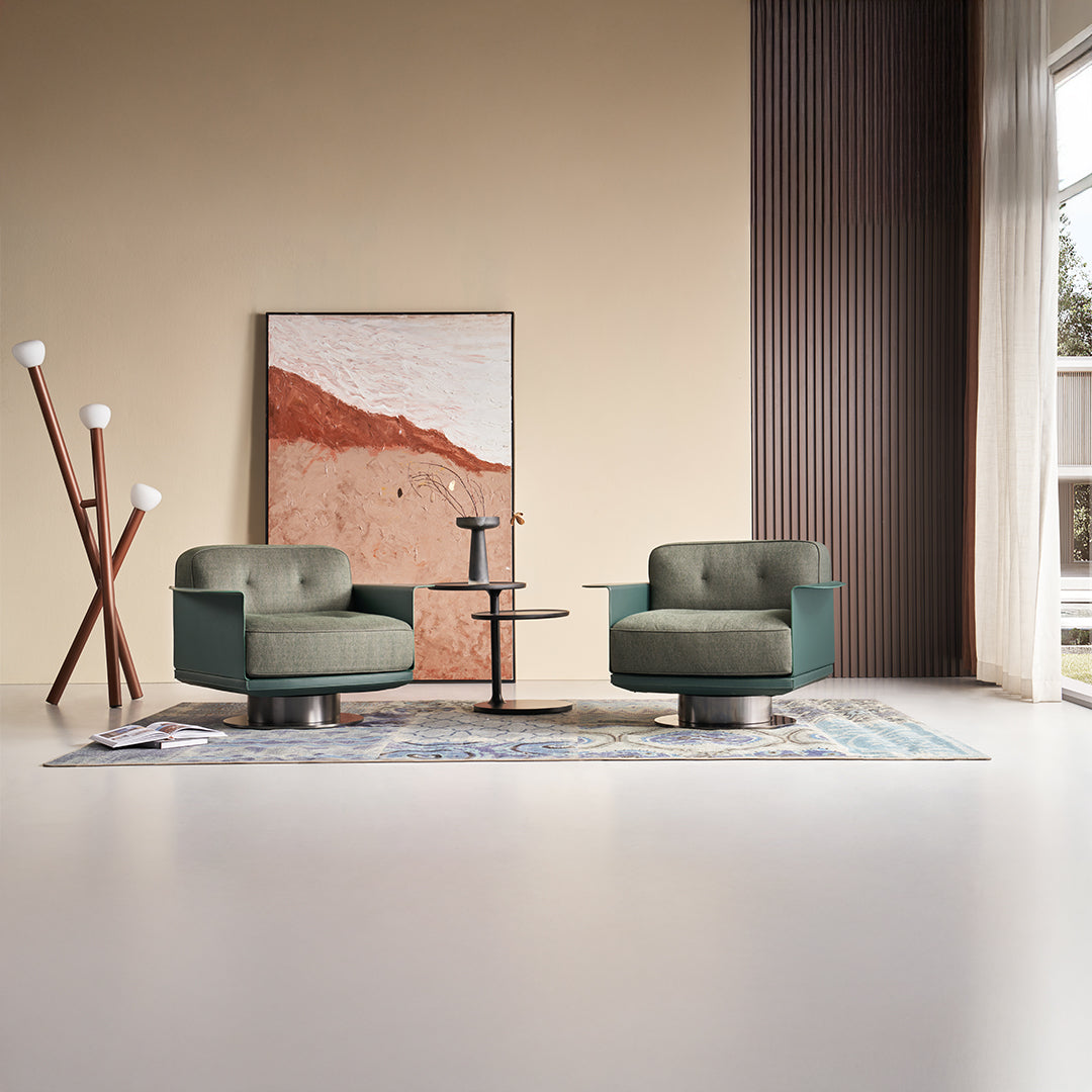 Green Avenor armchair from BEACON, featuring a comfortable design and plush upholstery.