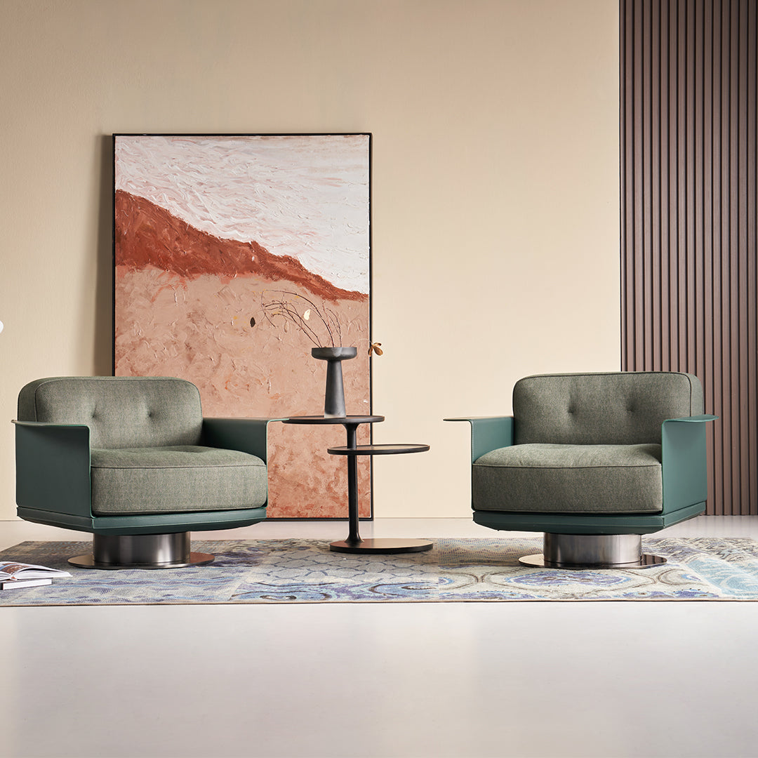 Green Avenor armchair by BEACON, featuring a plush fabric seat and modern design, ideal for living rooms or reading nooks.