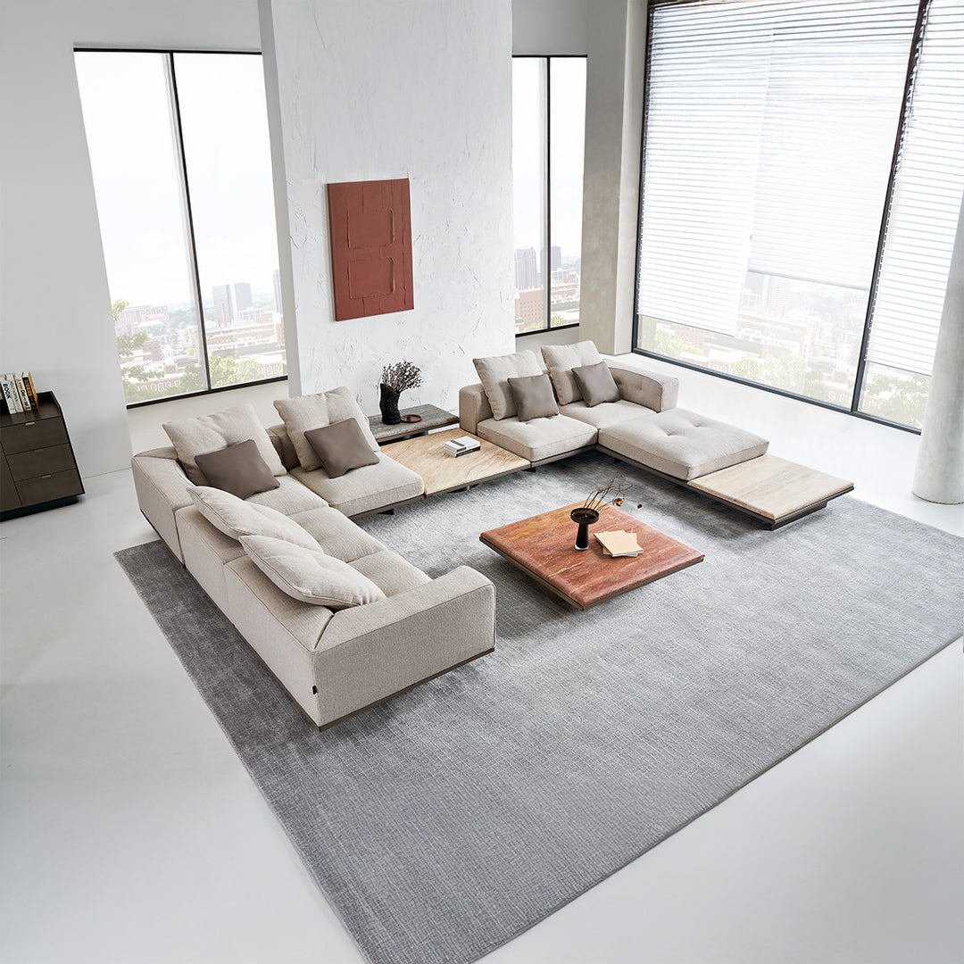 Avenor modular pouf with integrated side table by BEACON, featuring a modern design and soft fabric upholstery.